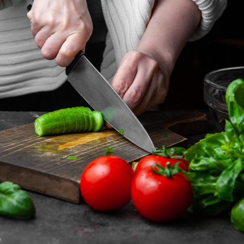 woman-cutting-cucumber-table.jpg
