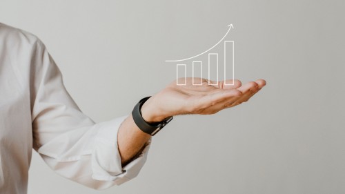 digital-increasing-bar-graph-with-businessman-hand-overlay.jpg