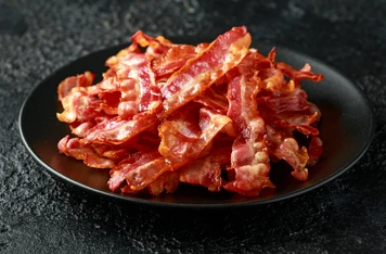 BACON-ON-METAL-PLATE.png