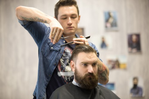 hairstylist-making-haircut-male-client.jpg